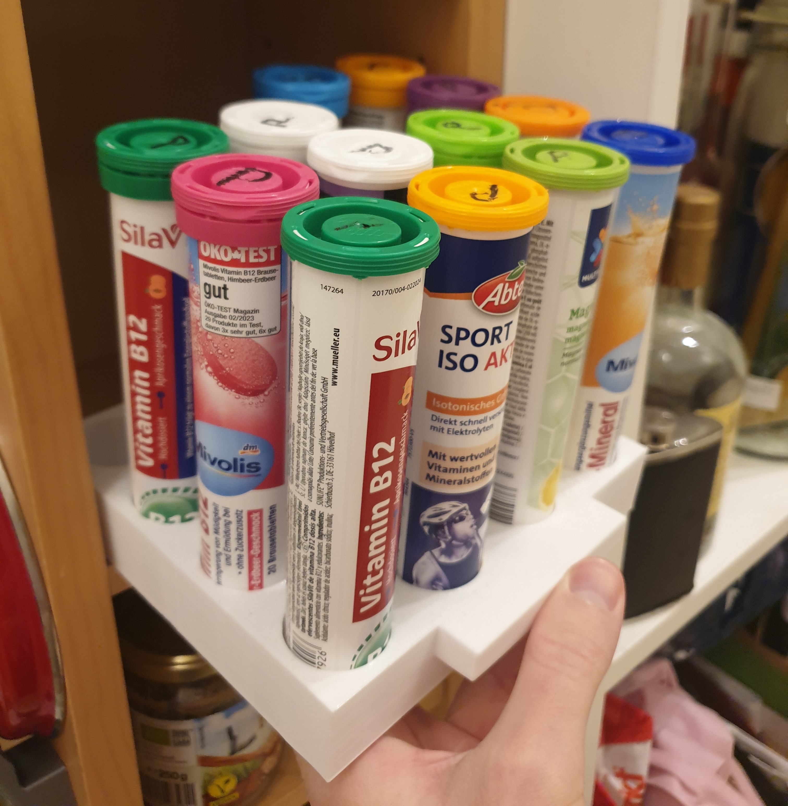 Storage for 16 vitamin effervescent tablets, with handle
