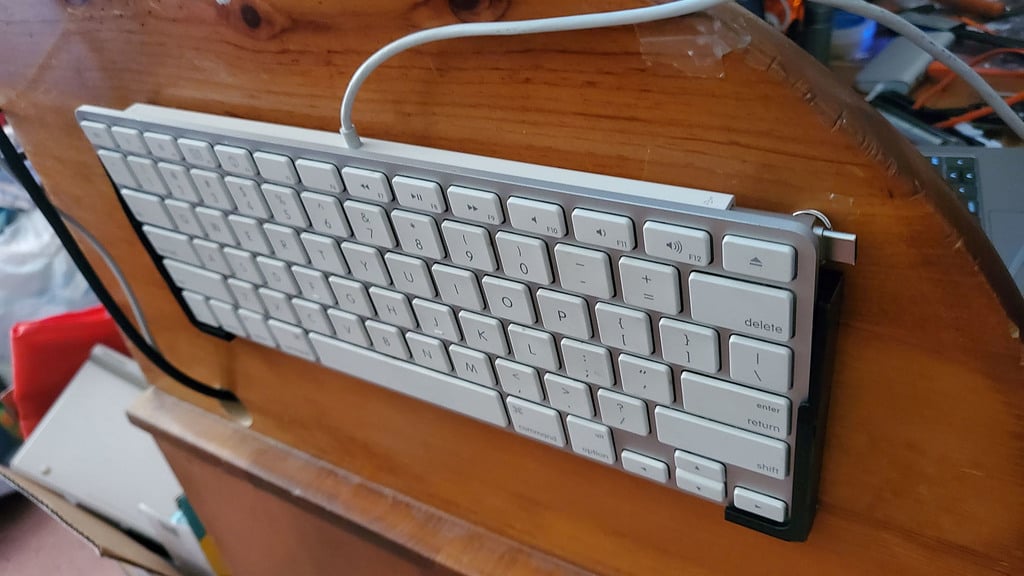 Wired Apple mini keyboard wall mount.