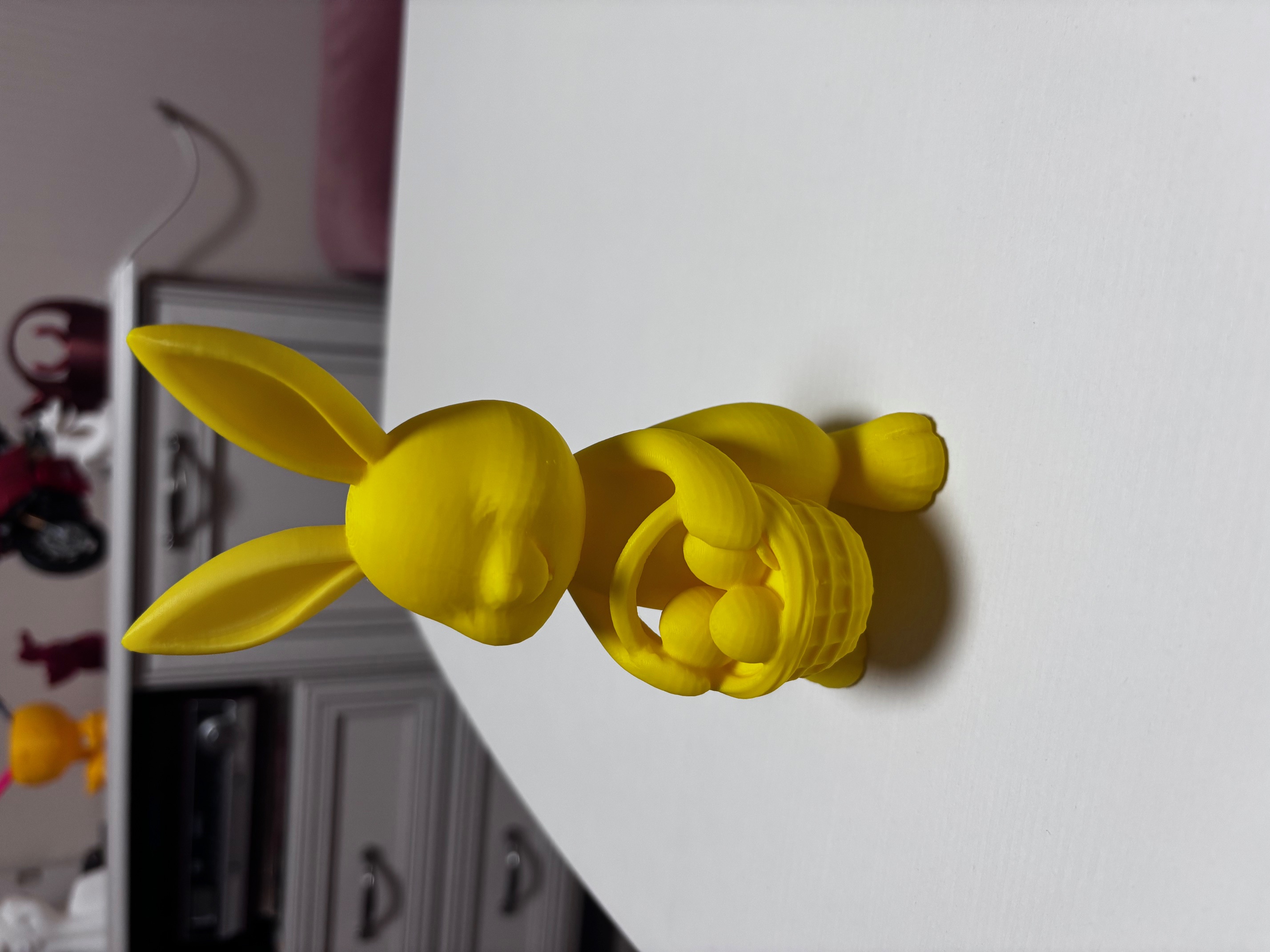 Easter bunny holding egg basket decoration