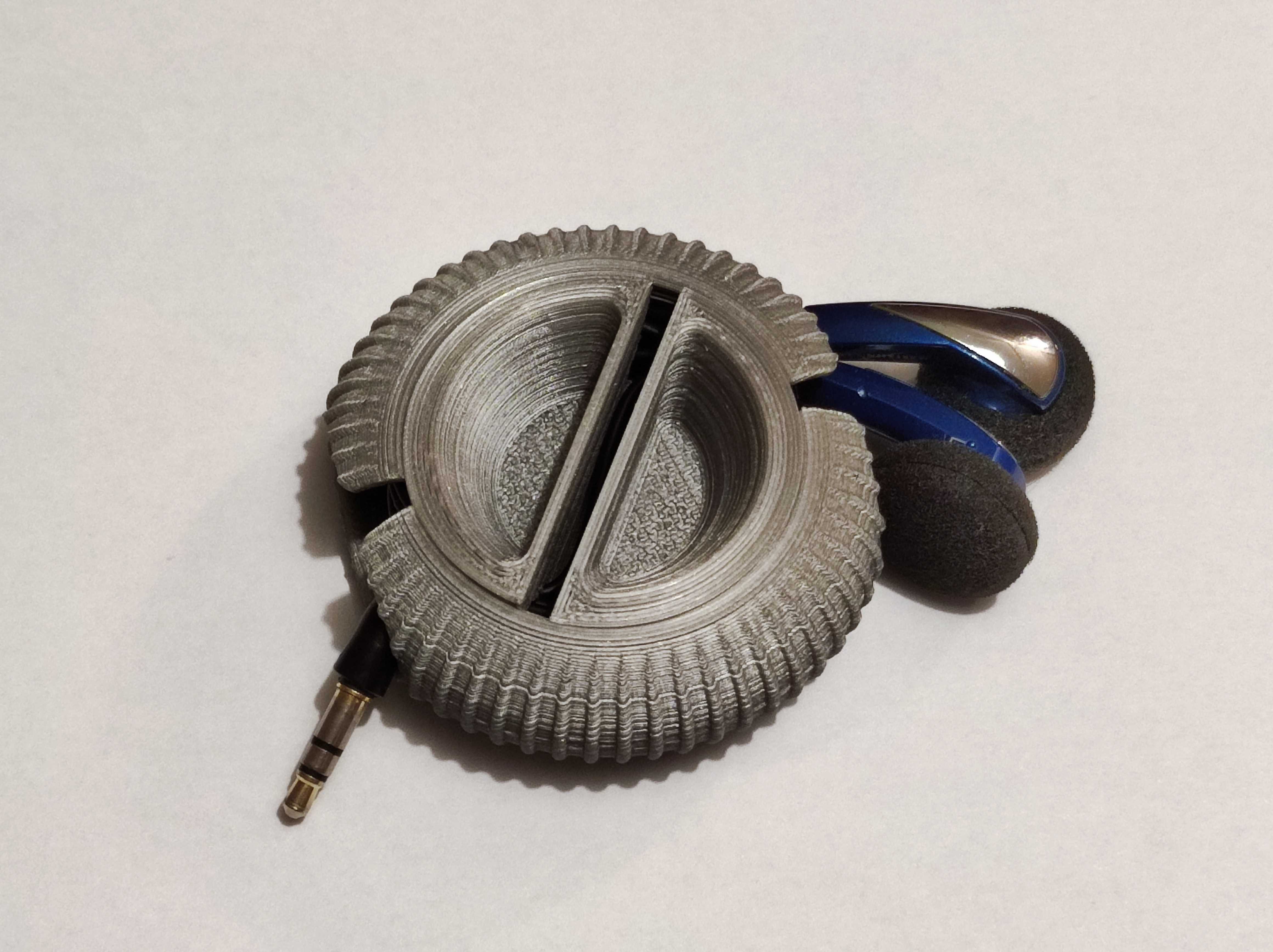 Print-in-place earbud spool