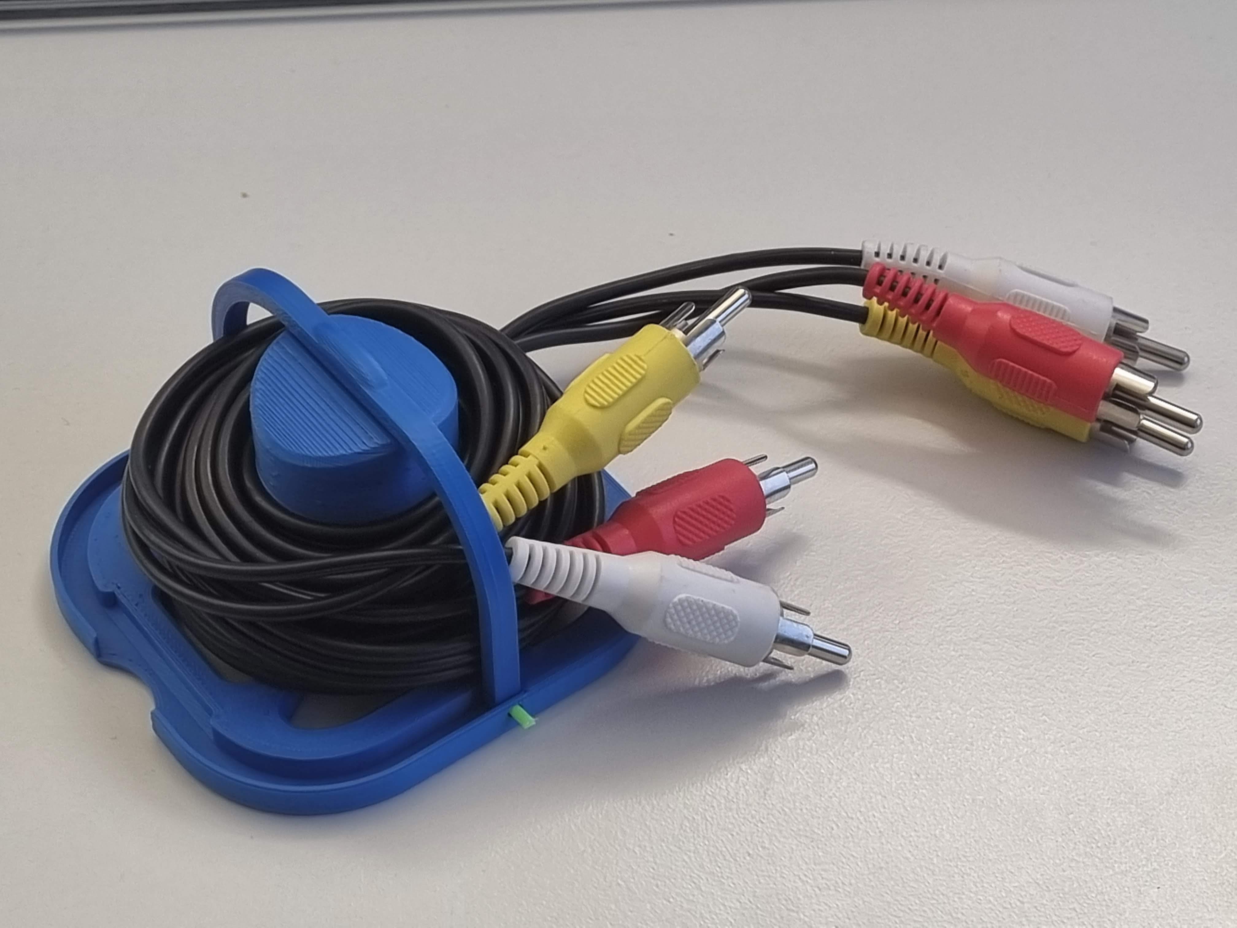 Cable spool with filament hinge