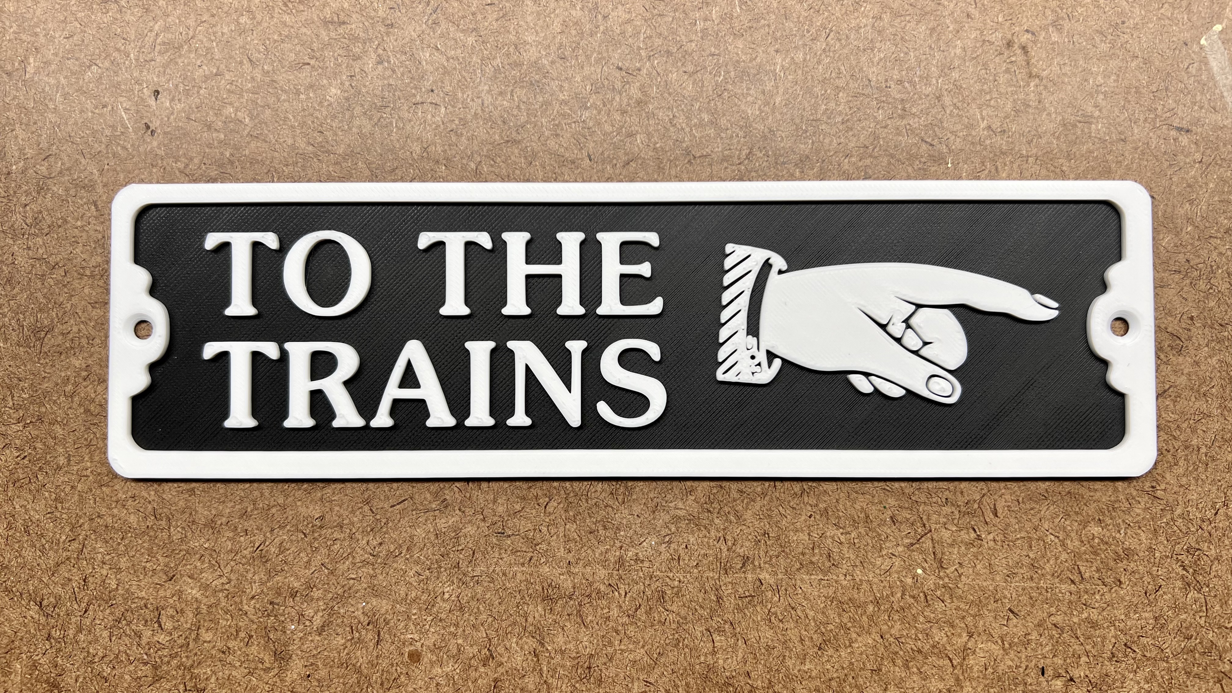 To The Trains Sign