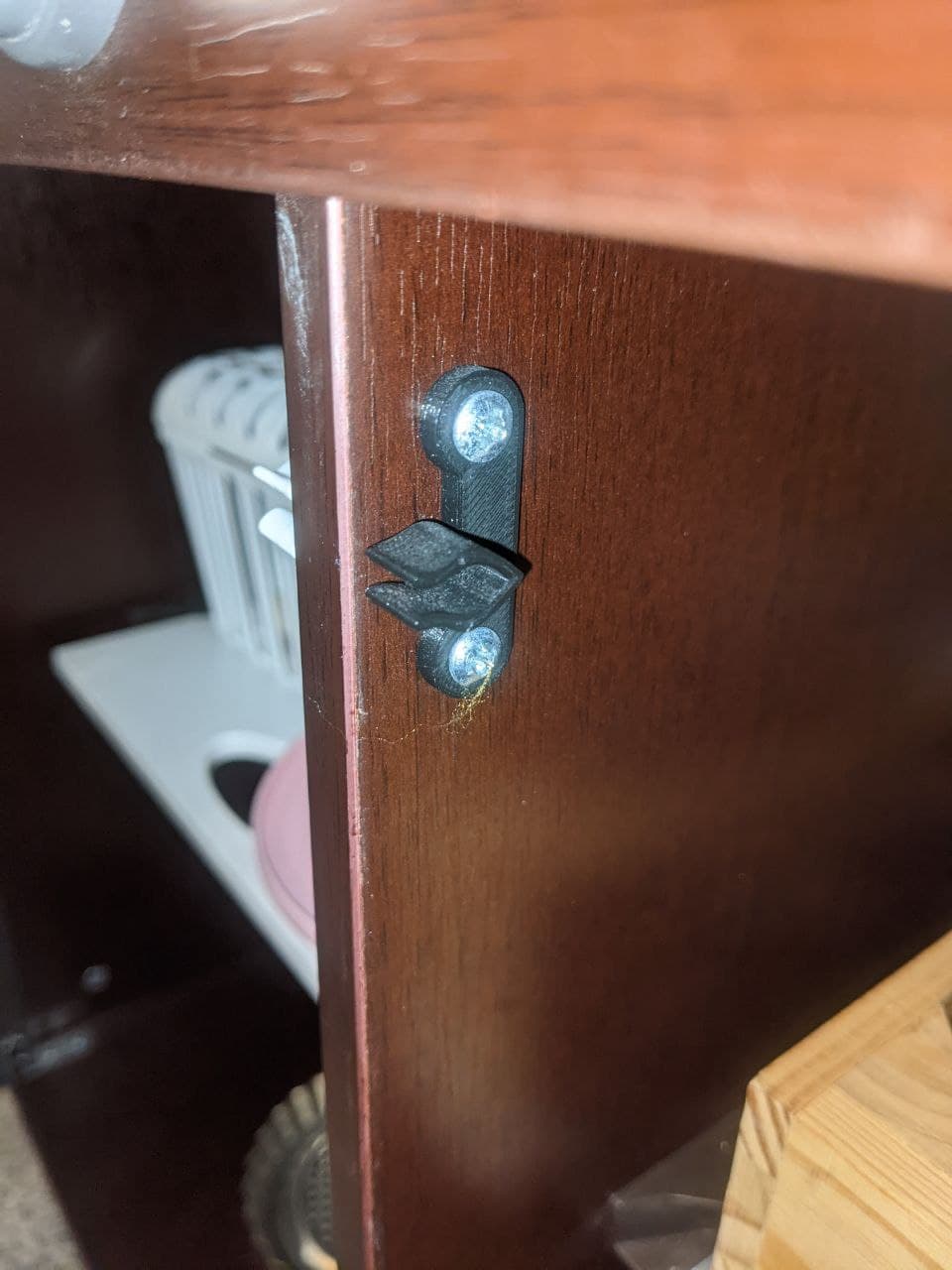 Clip for toy cabinet