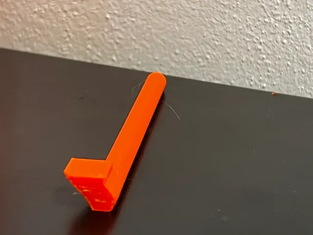 Axis for auto rewind spool hub