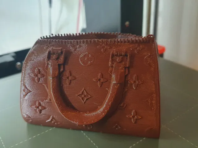 Vuitton bag flower pot modified/remixed with bigger space inside and a drain hole.
