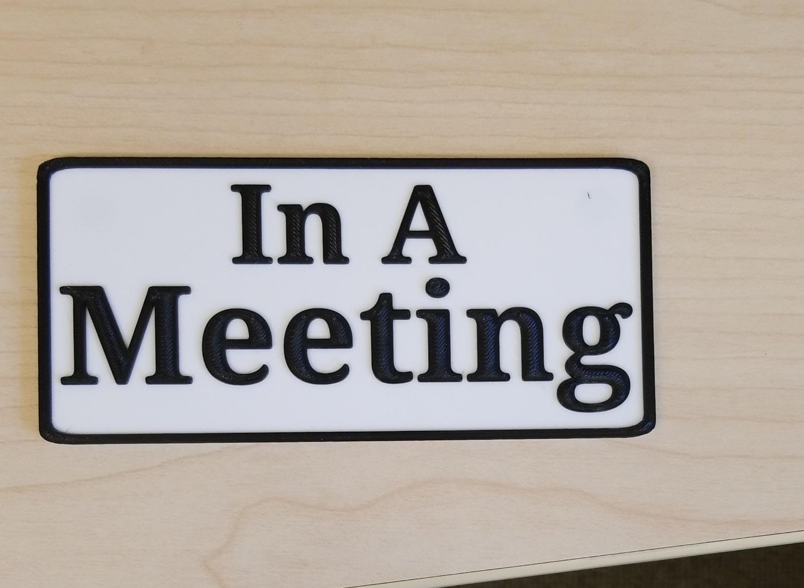 In A Meeting sign for door - with holes for magnets