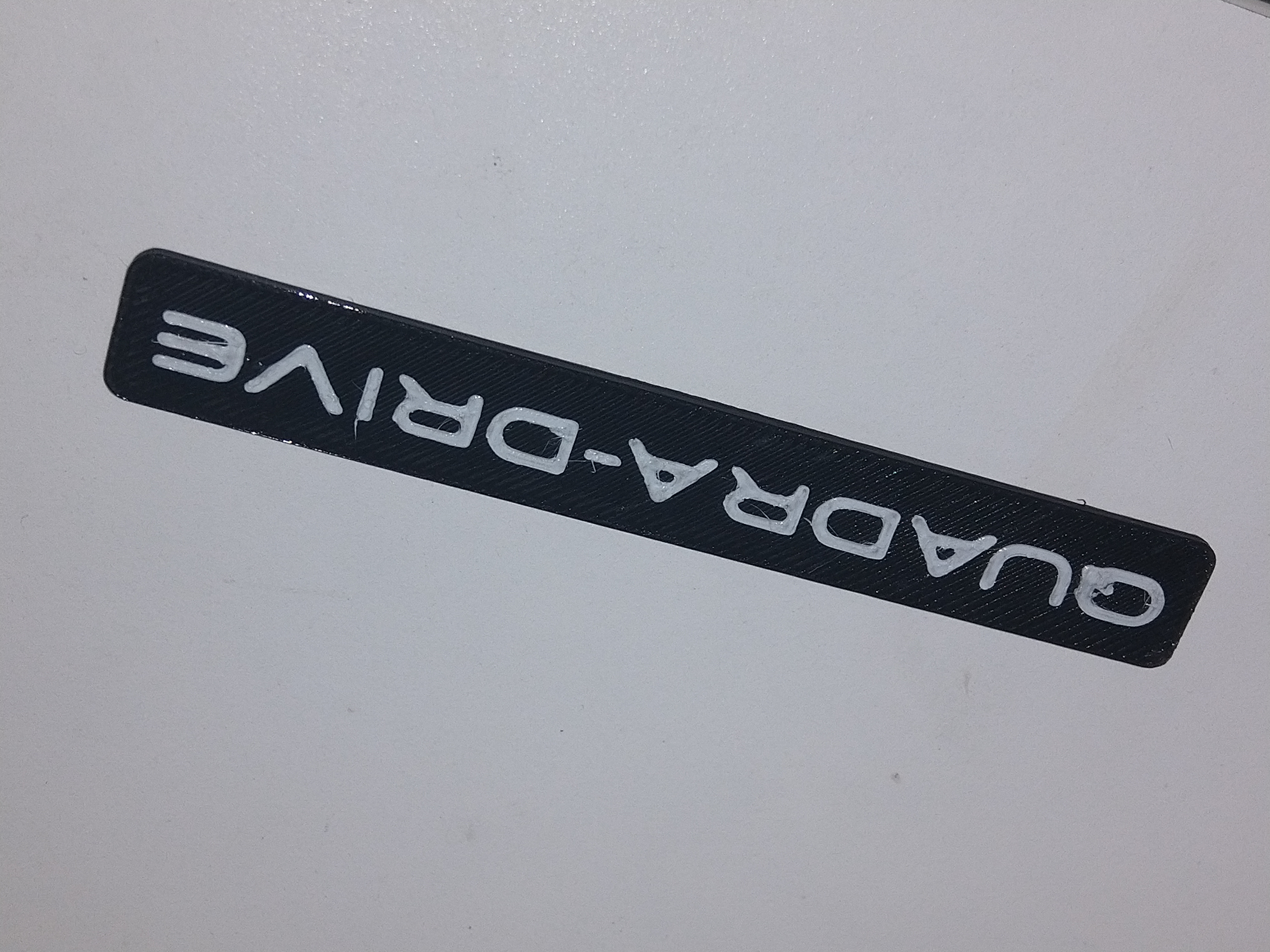 Mopar 55155994AB, Jeep WJ 1999-2004 "Quadra-Drive" Emblem