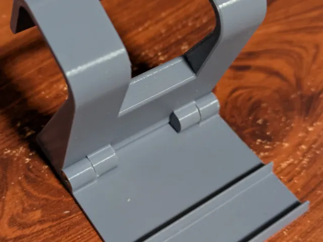 Foldable plane phone holder