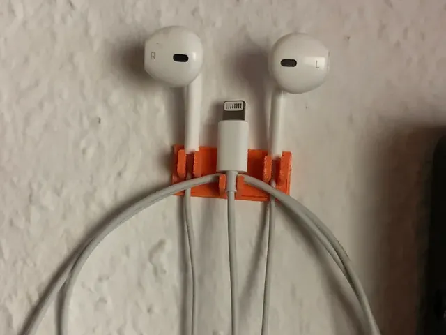 Apple headphone wall holder