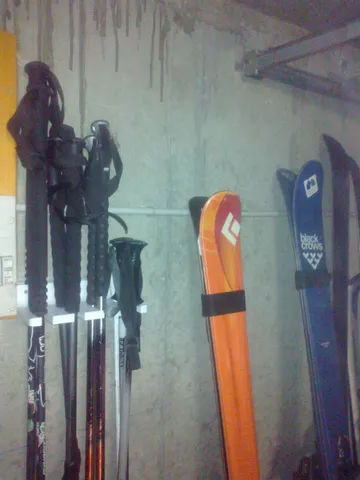 Ski pole wall mount