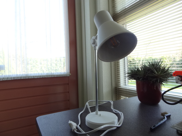 Desk lamp with adjustable angle.