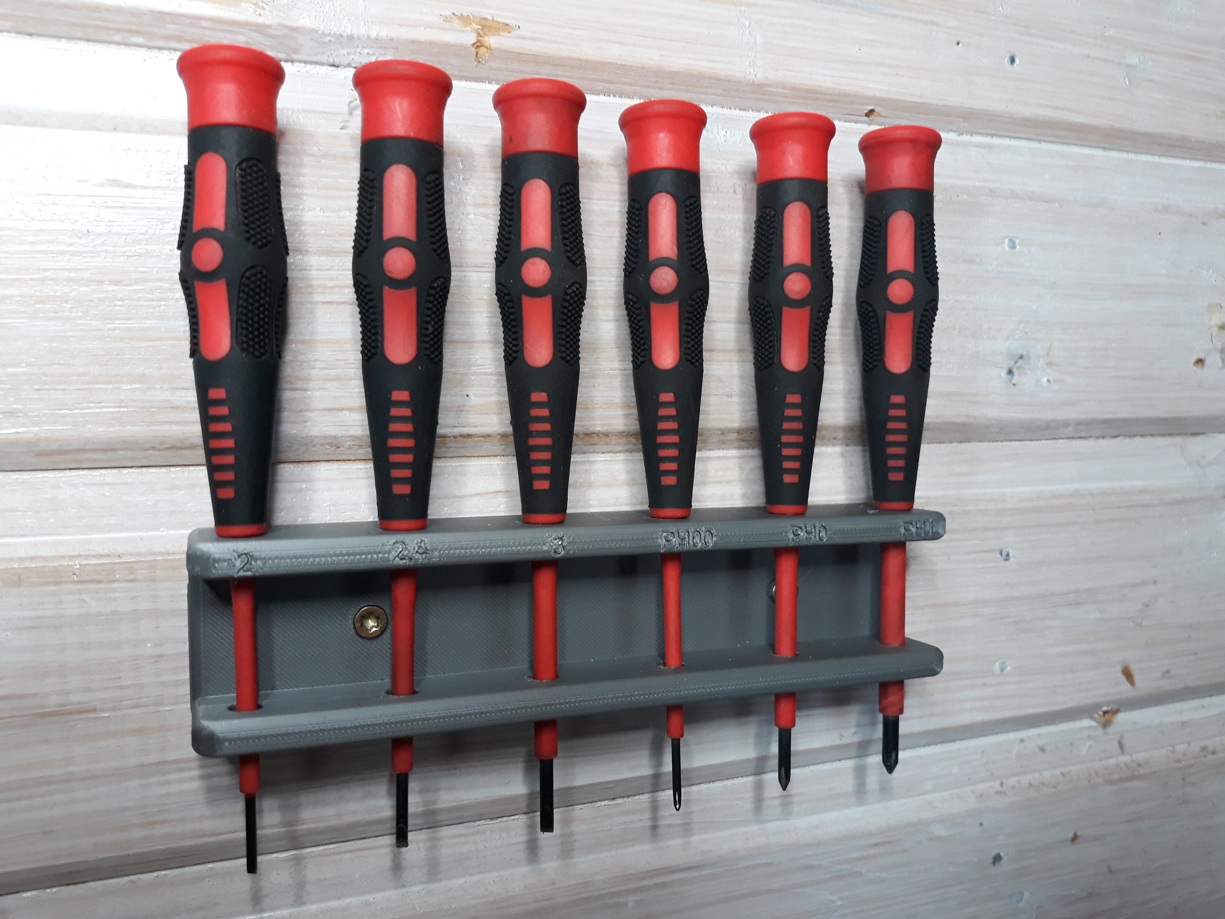 Wall mounted screwdriver holder