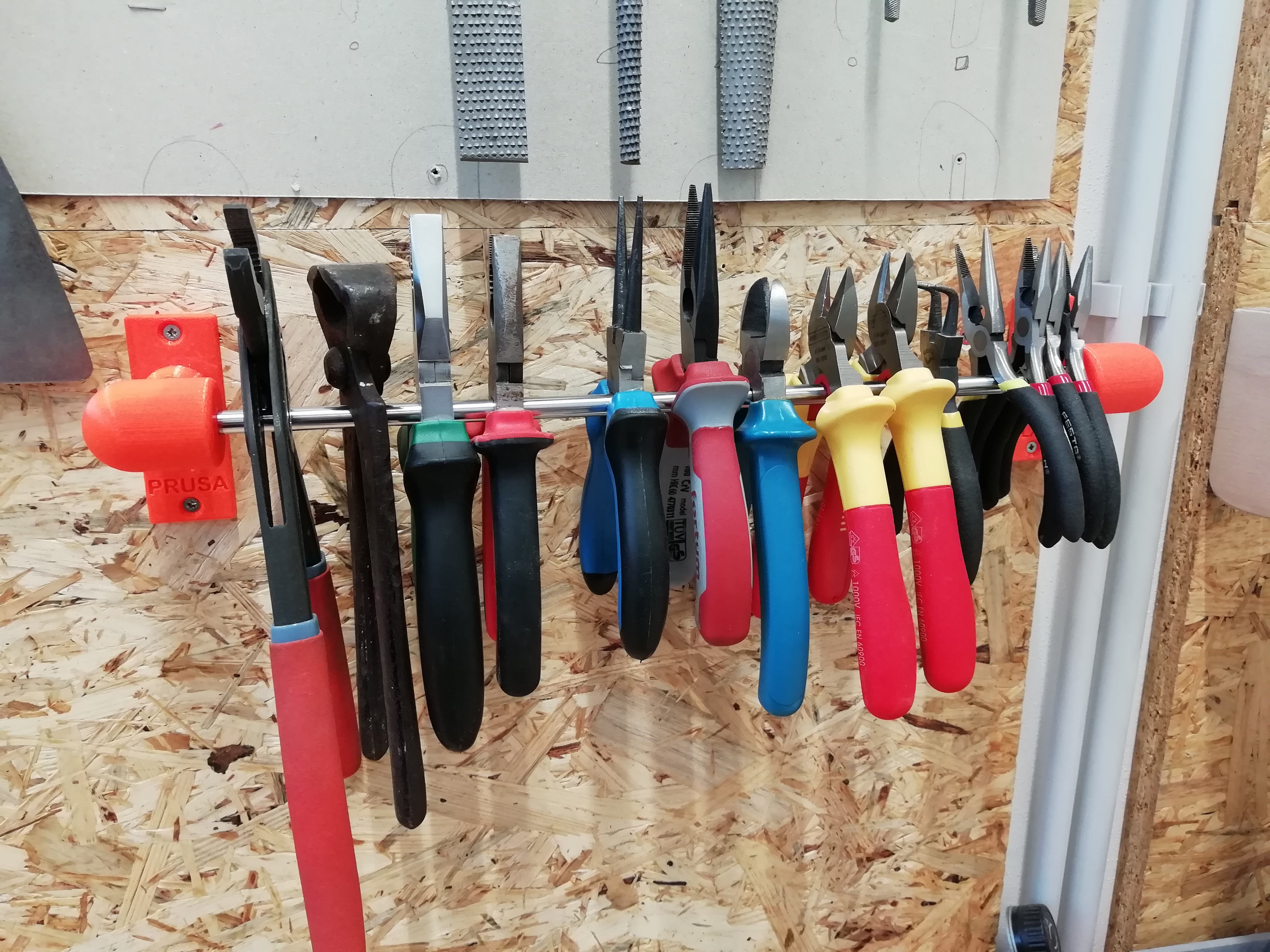 Wall mounted pliers holder