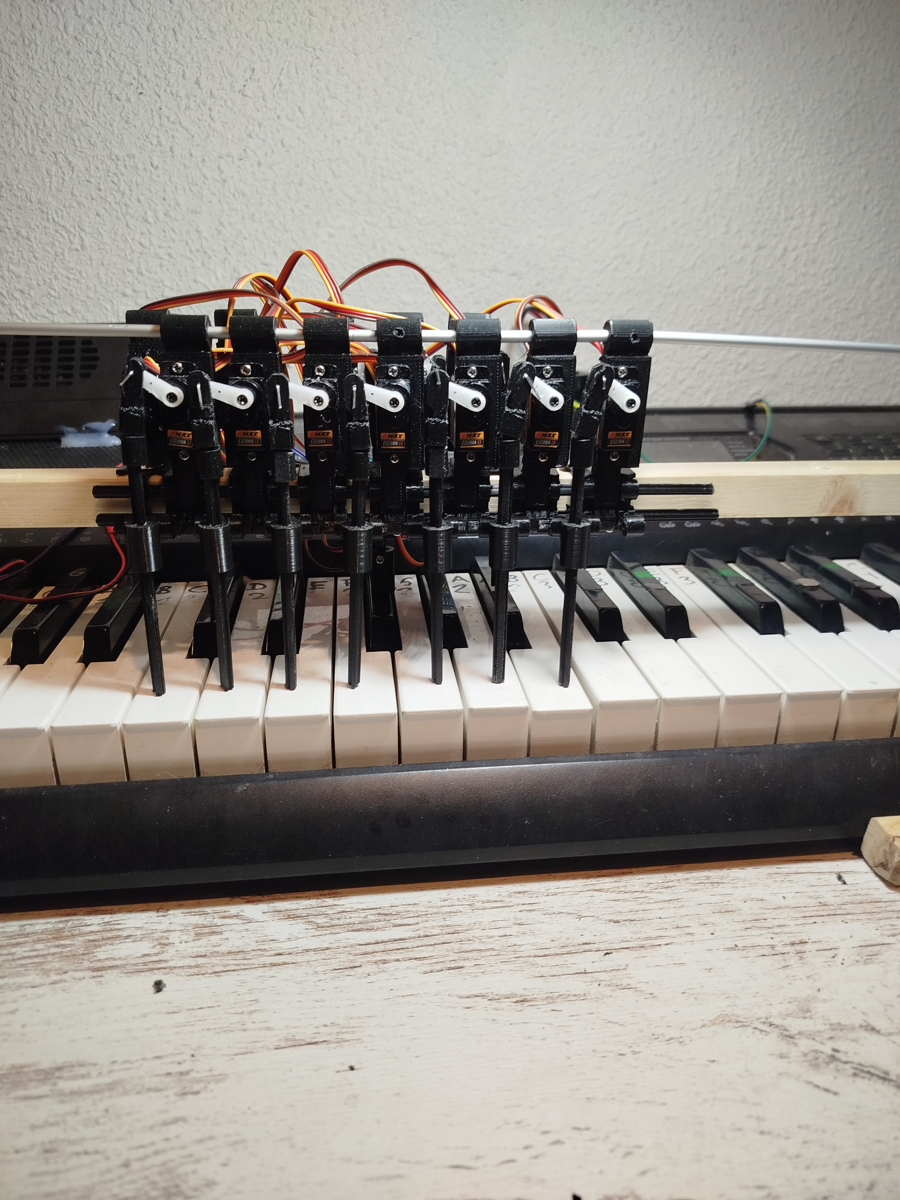 Piano robot. Synchronized Servo Motion for MIDI Playback
