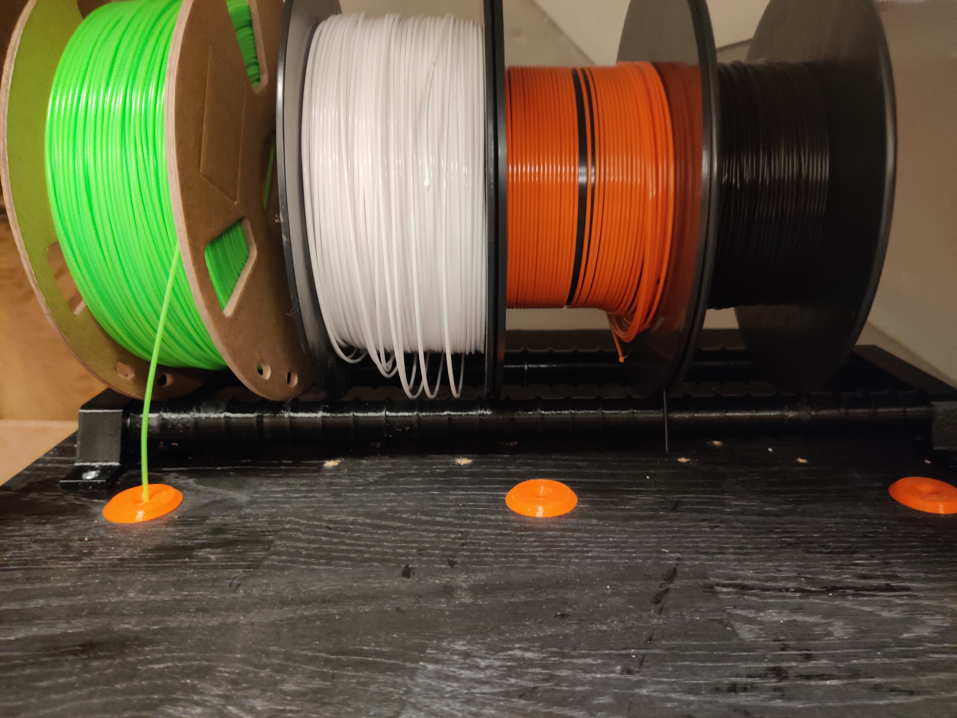 Filament holder for enclosure