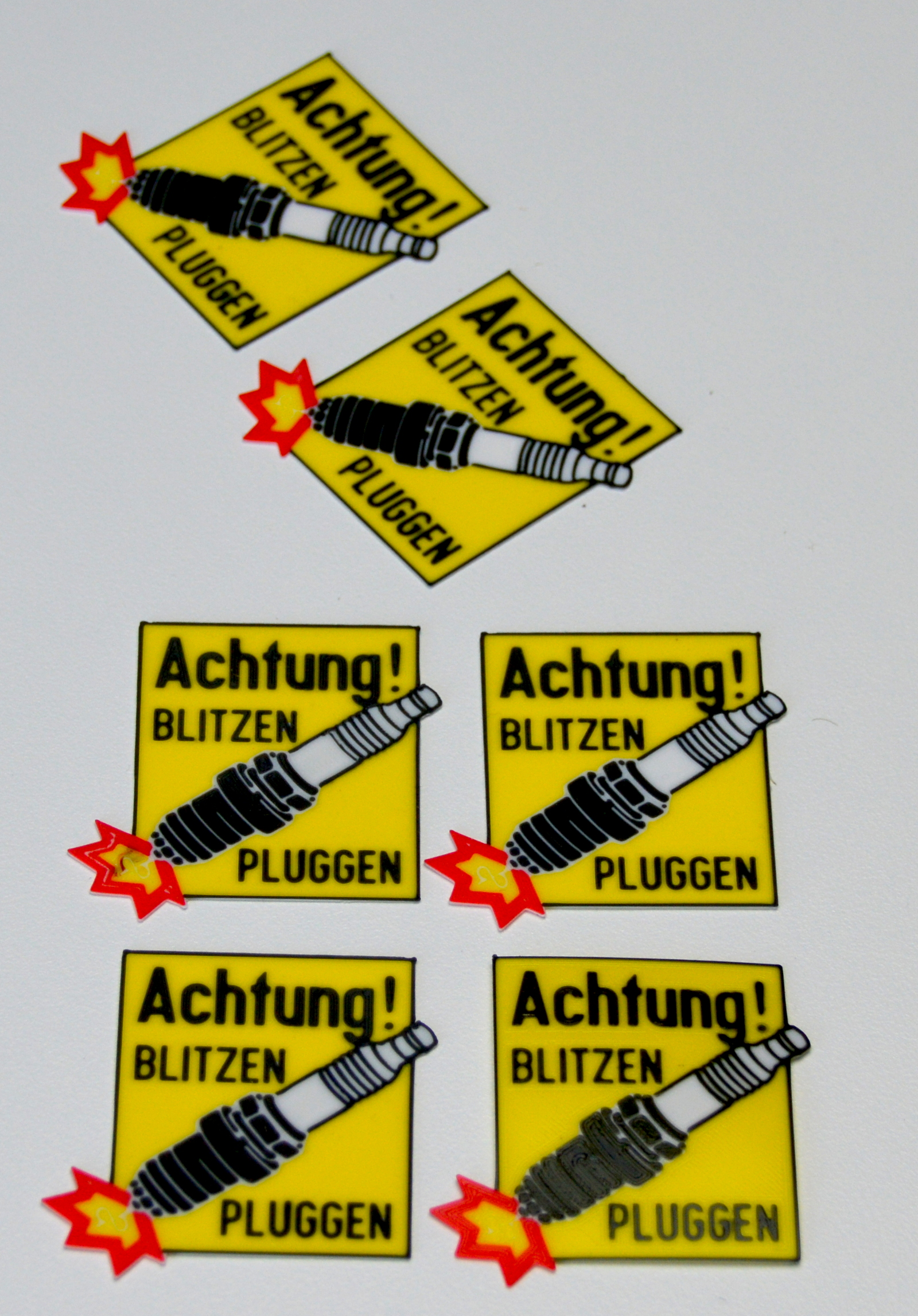 Spark plug warning sign - for 2-stroke and petrol engine applications