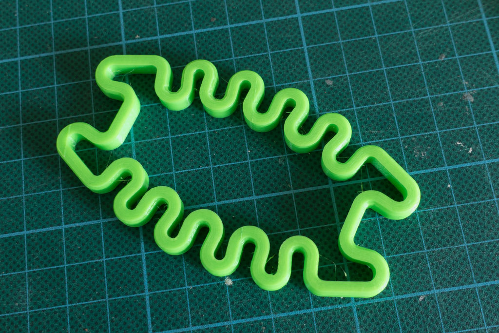 Squished Bug Earphone Holder - springy