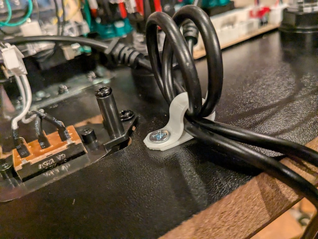 Single screw wire harness loop