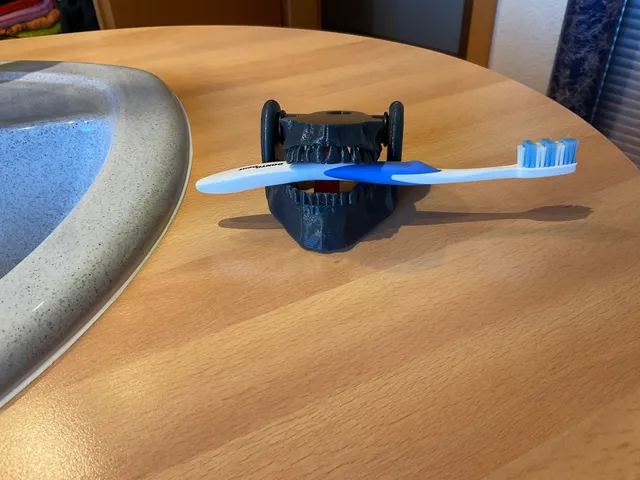 Tooth - Brushholder with kick out function
