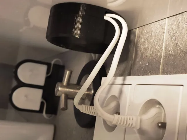 Sonic toothbrush charger holder with cable organizer