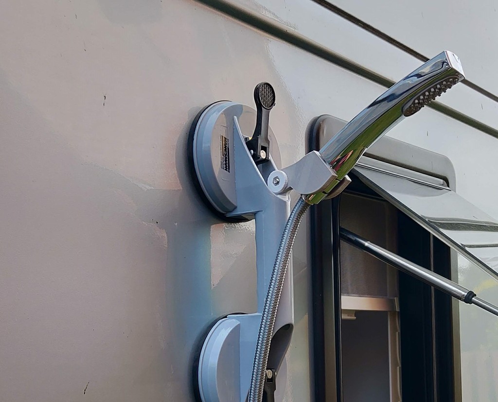 External shower head holder for camper van