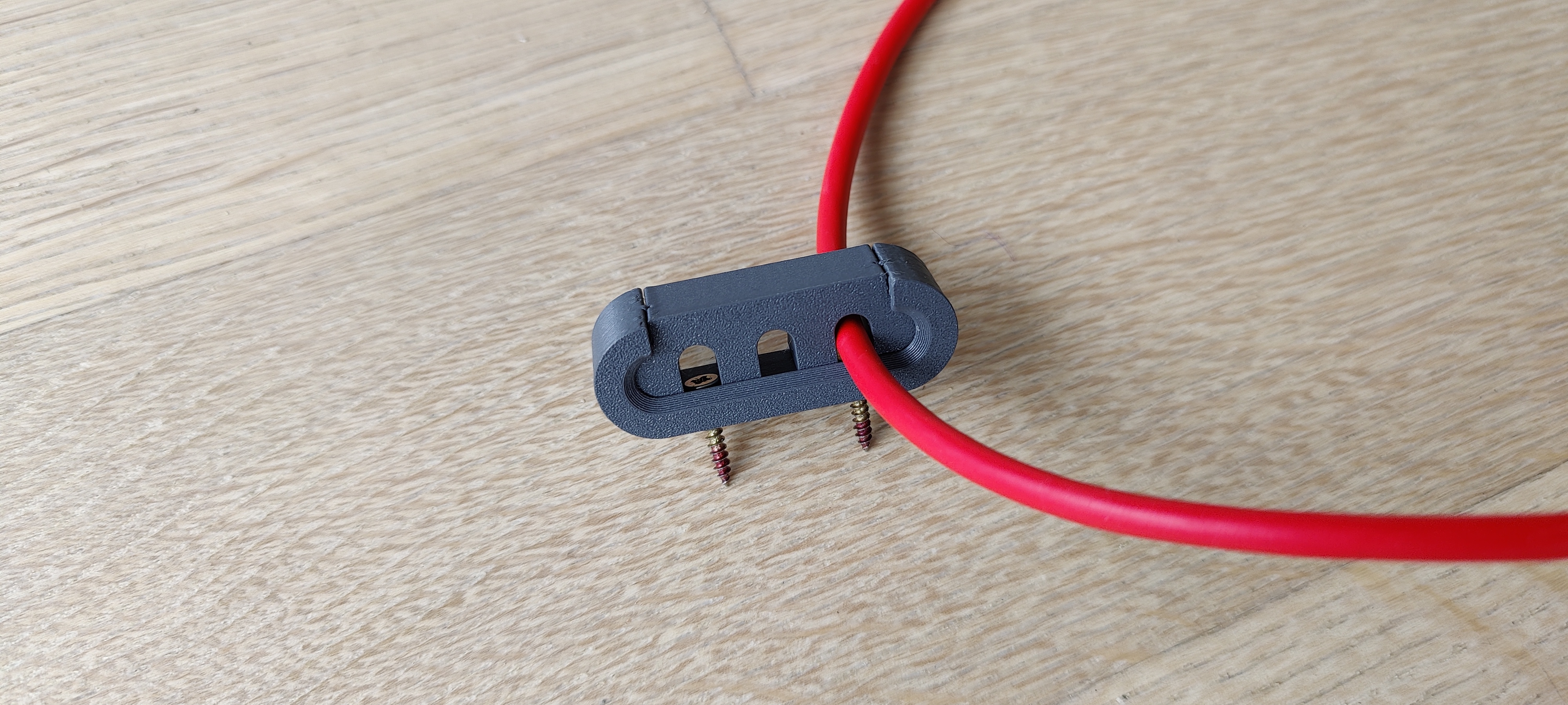 Elegant Cable Clip wall mount, resizable, reusable.