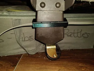 Cord Guide that hangs on a bed's leg