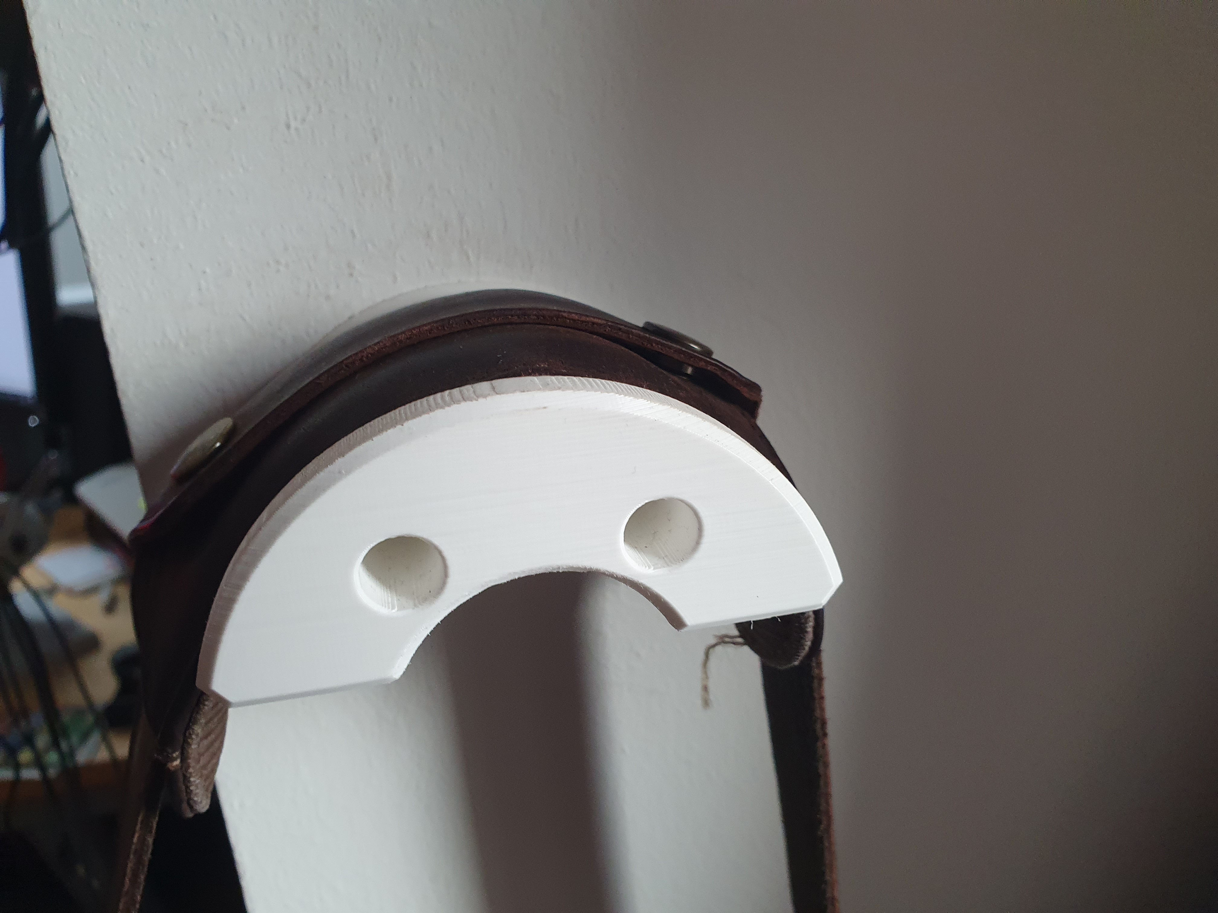 Wall hook for a laptop bag.