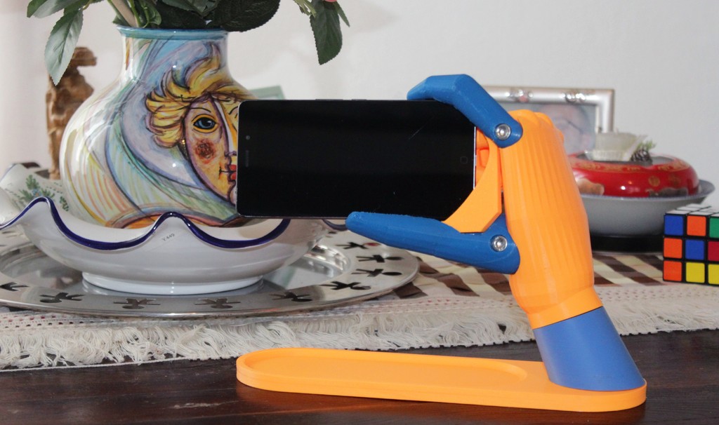 Universal hand-shaped phone holder (gravity type) - Supporto telefono universale a forma di mano