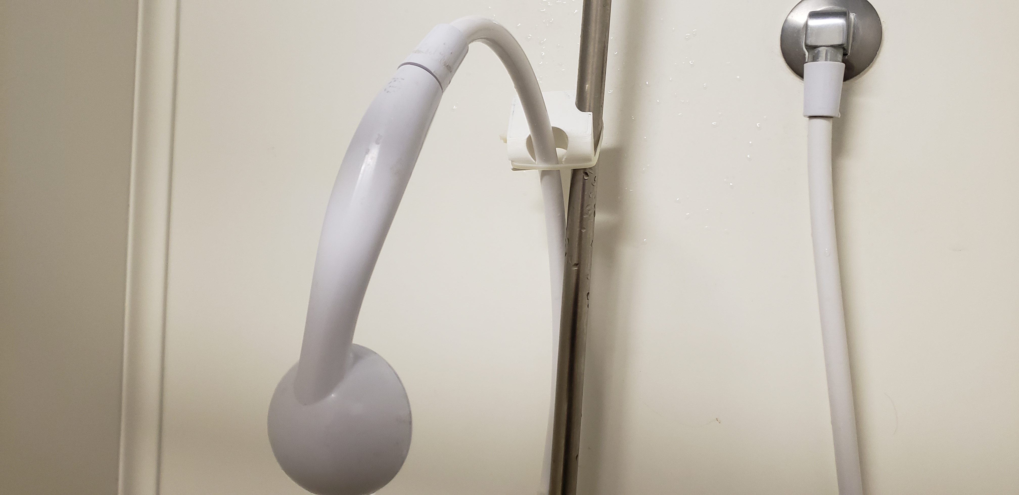 Shower handheld holder simple and quick fix by Usman Suriono