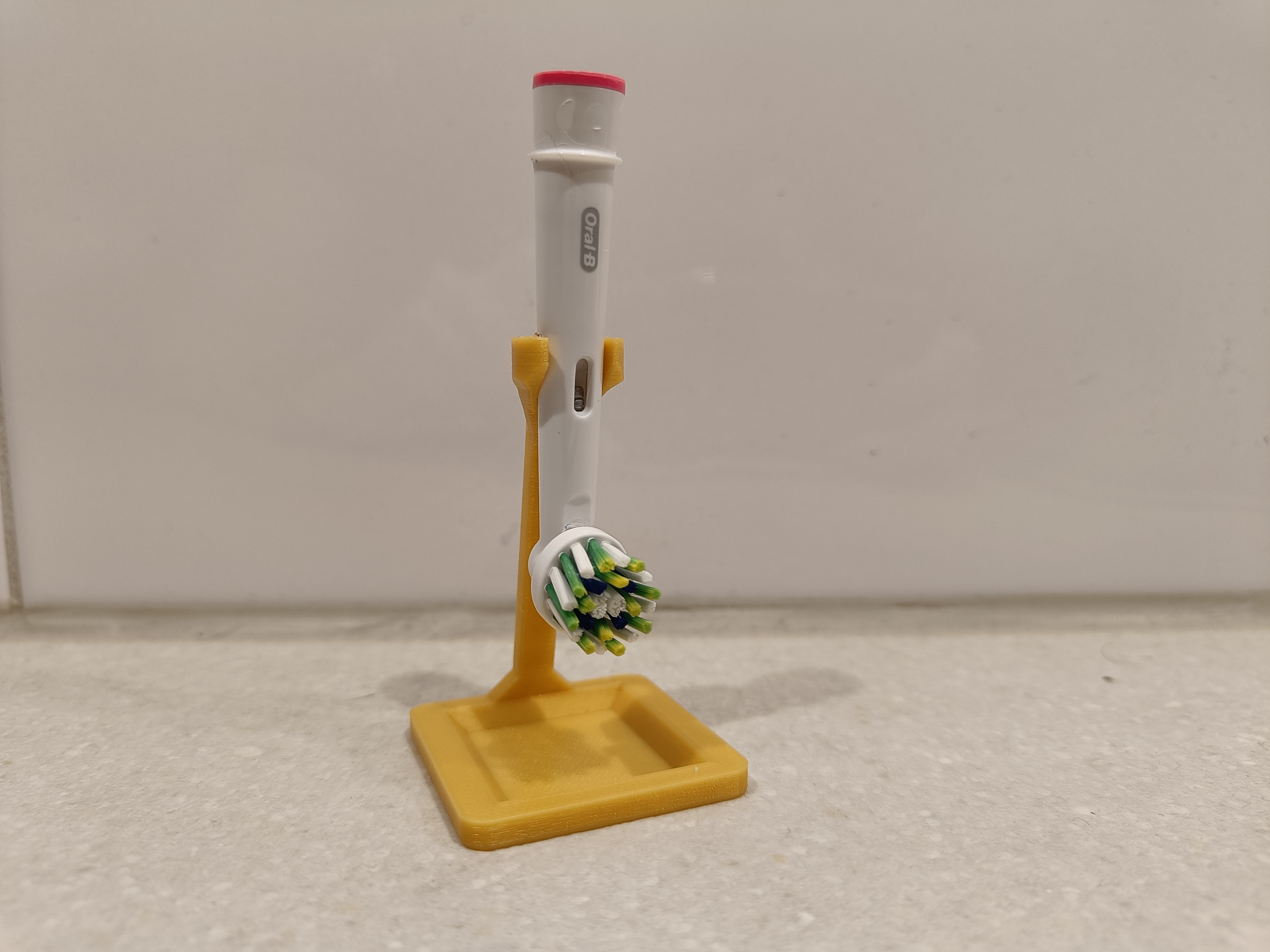 Electric tooth brush head stand with dripping tray.