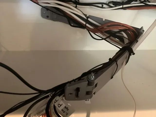 Cable management hinged swing arm