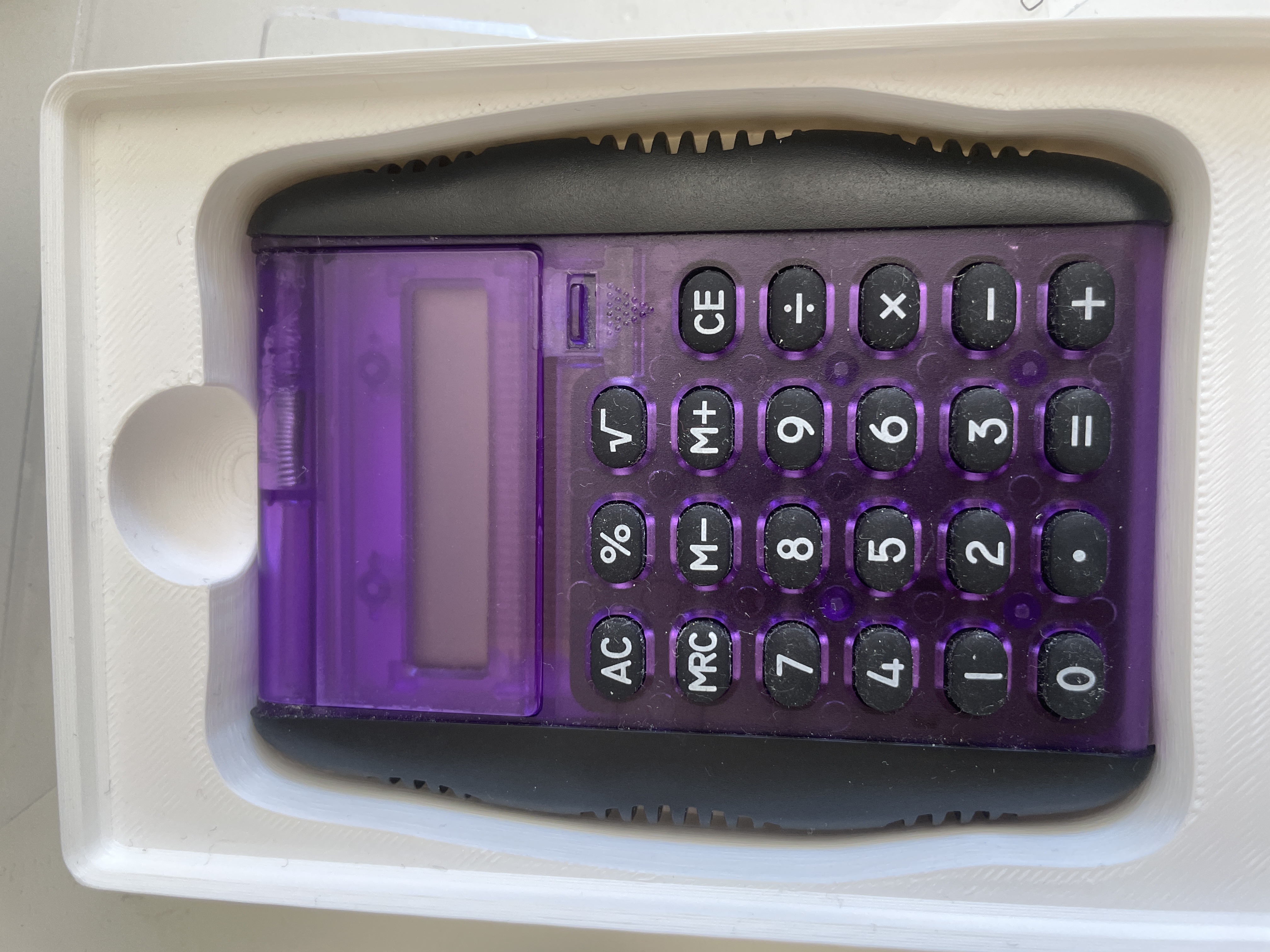 Gridfinity holder for Flying Tiger calculator.