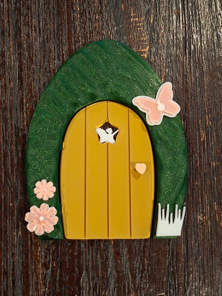 Fairy door with stick on decorations and hinged door