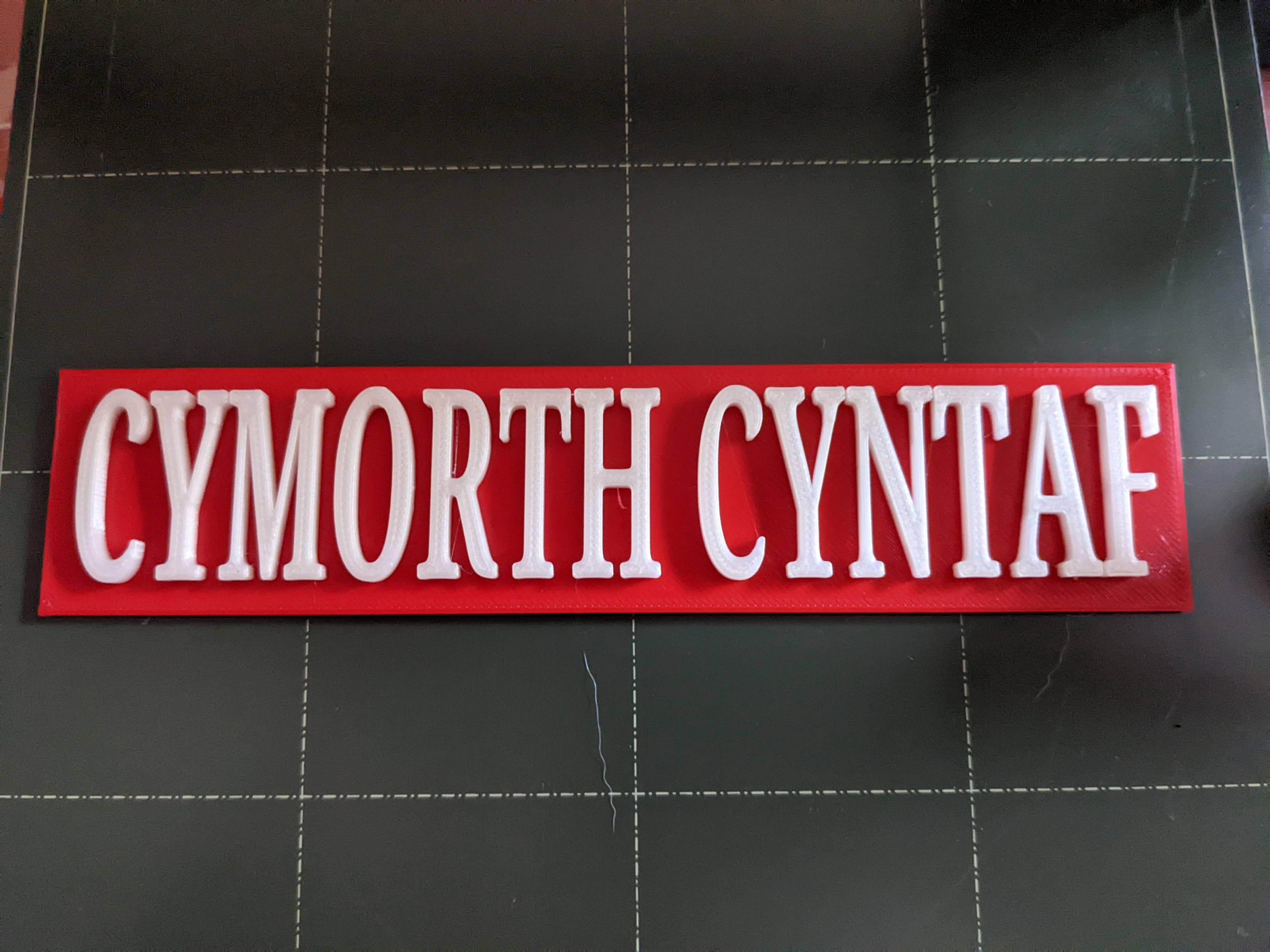 First Aid sign in Welsh - Arwydd Cymorth Cyntaf yn Gymraeg