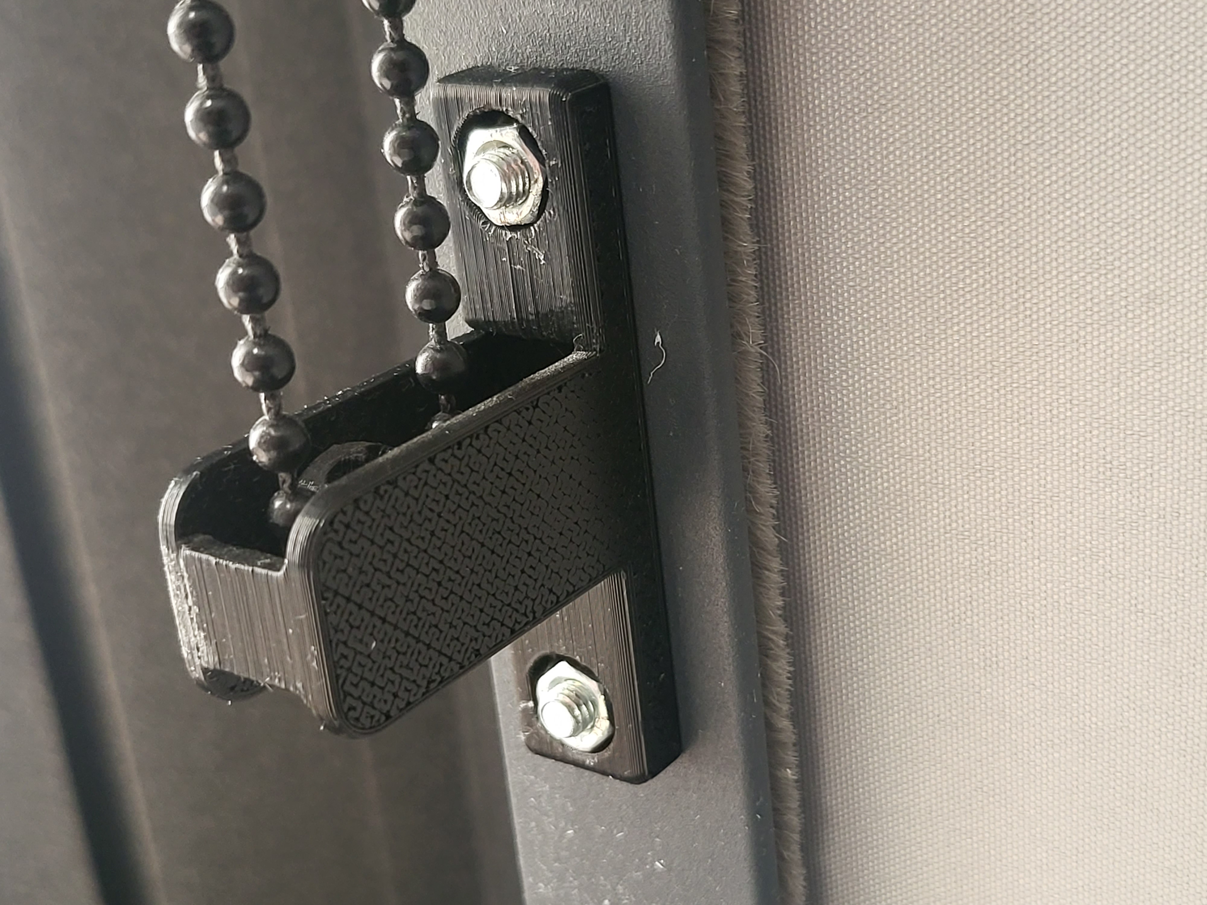 Rollet cord holder mount.