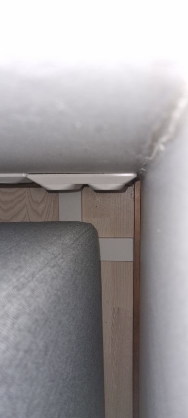 Keep sofa from moving towards the wall