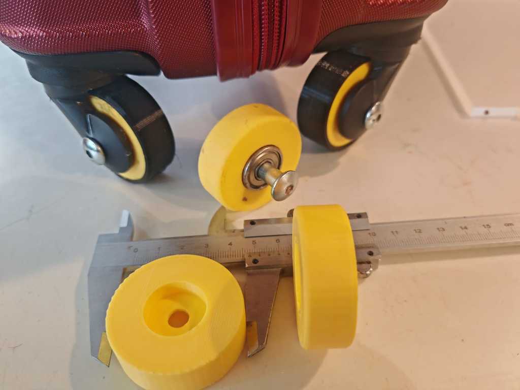 Travel suitcase wheel with tire and barring