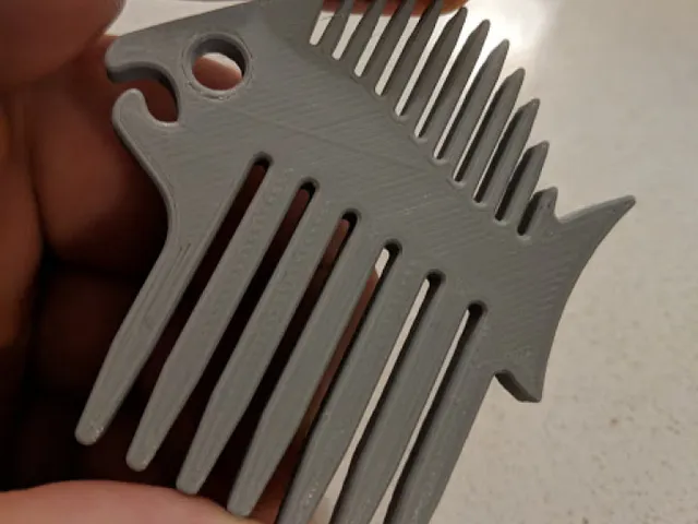 Fish-shaped beard comb