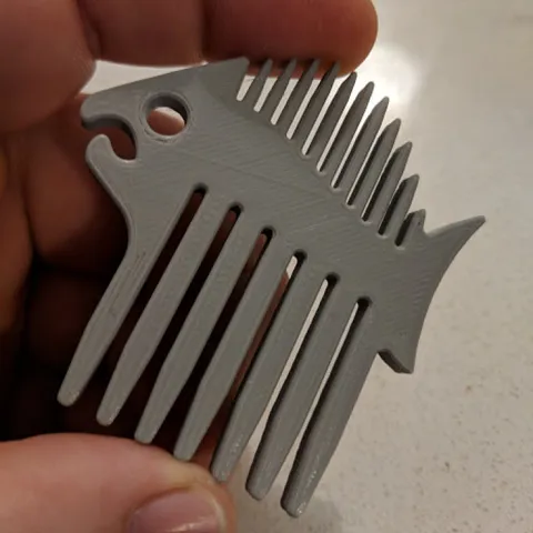 Fish-shaped beard comb