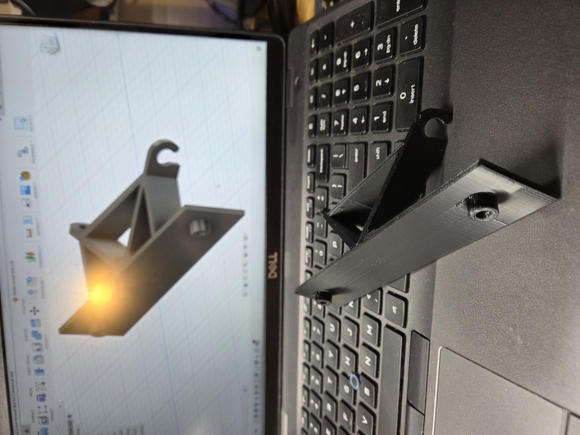 Bracket to mount small ceramic heater in tent enclosure
