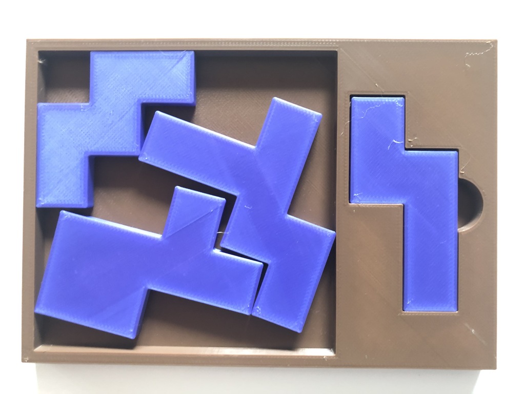Four Sleazy Pieces - Tray-packing puzzle by Stewart Coffin (STC #169-A)
