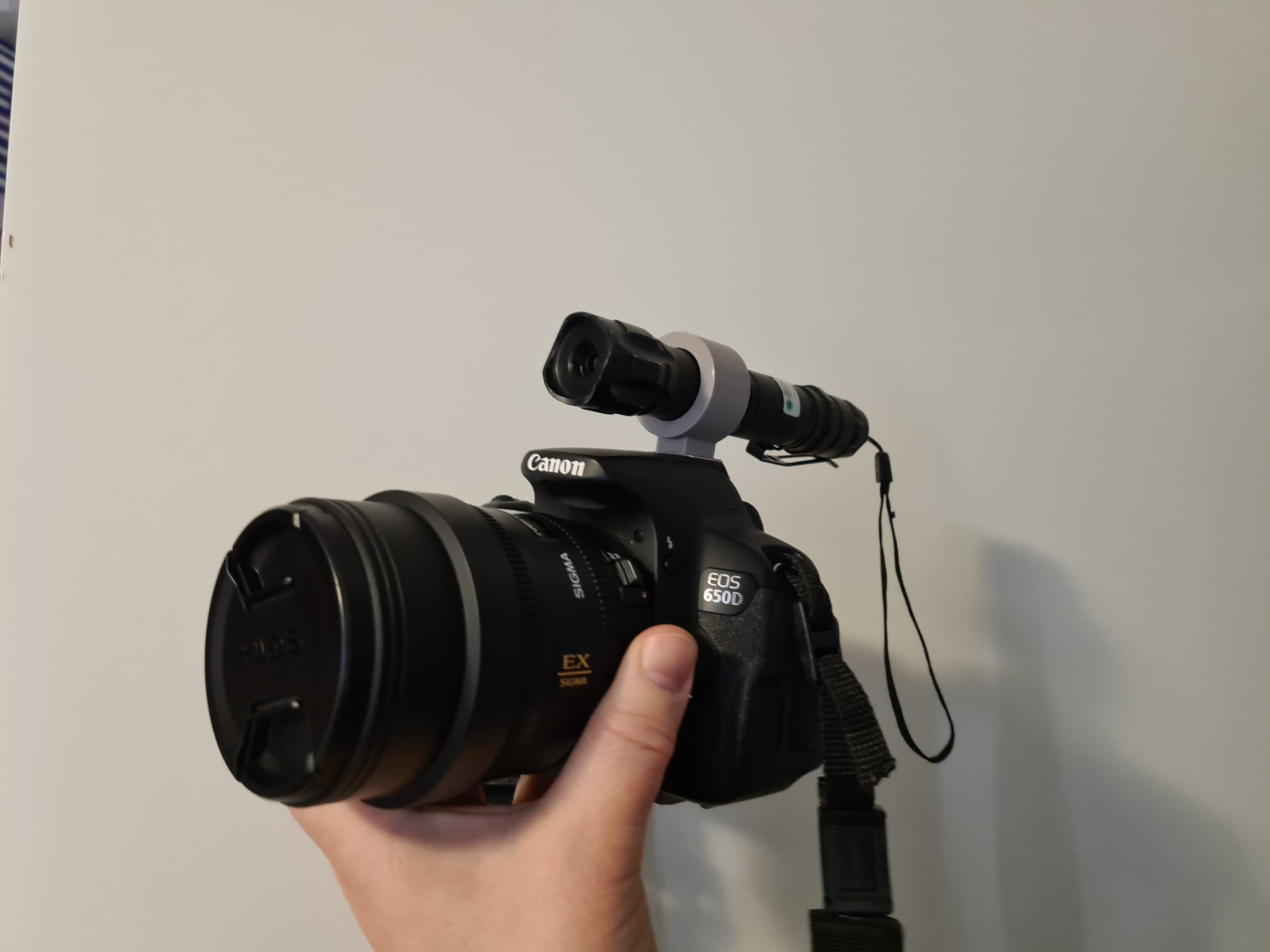 Holder for laser to camera hot shoe connector