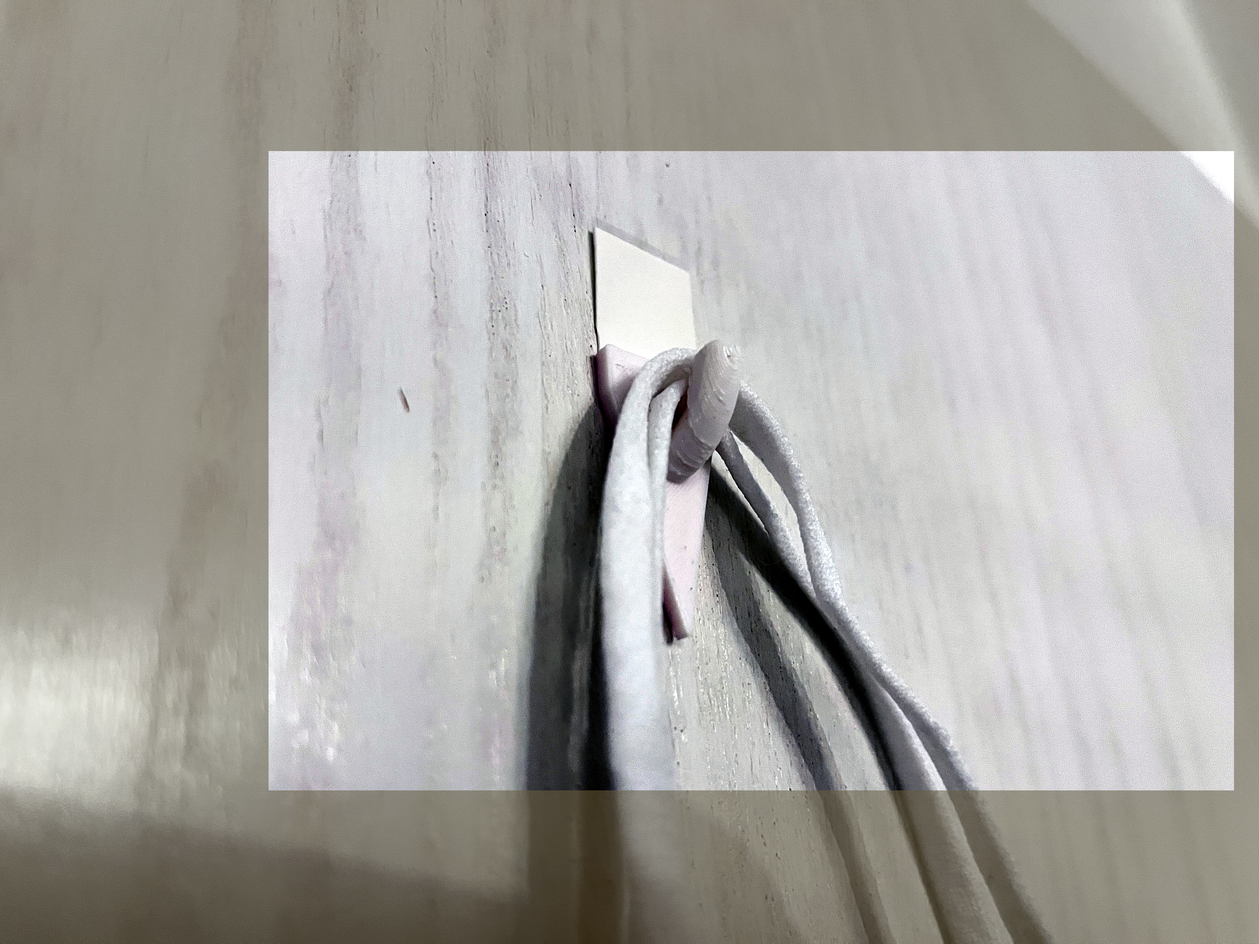 A hook, fitting for Tesa Powerstrips