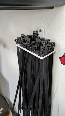 Wall mounted zip tie organizer