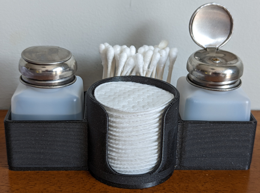 Liquid dispenser caddy with cotton swab/pad holders
