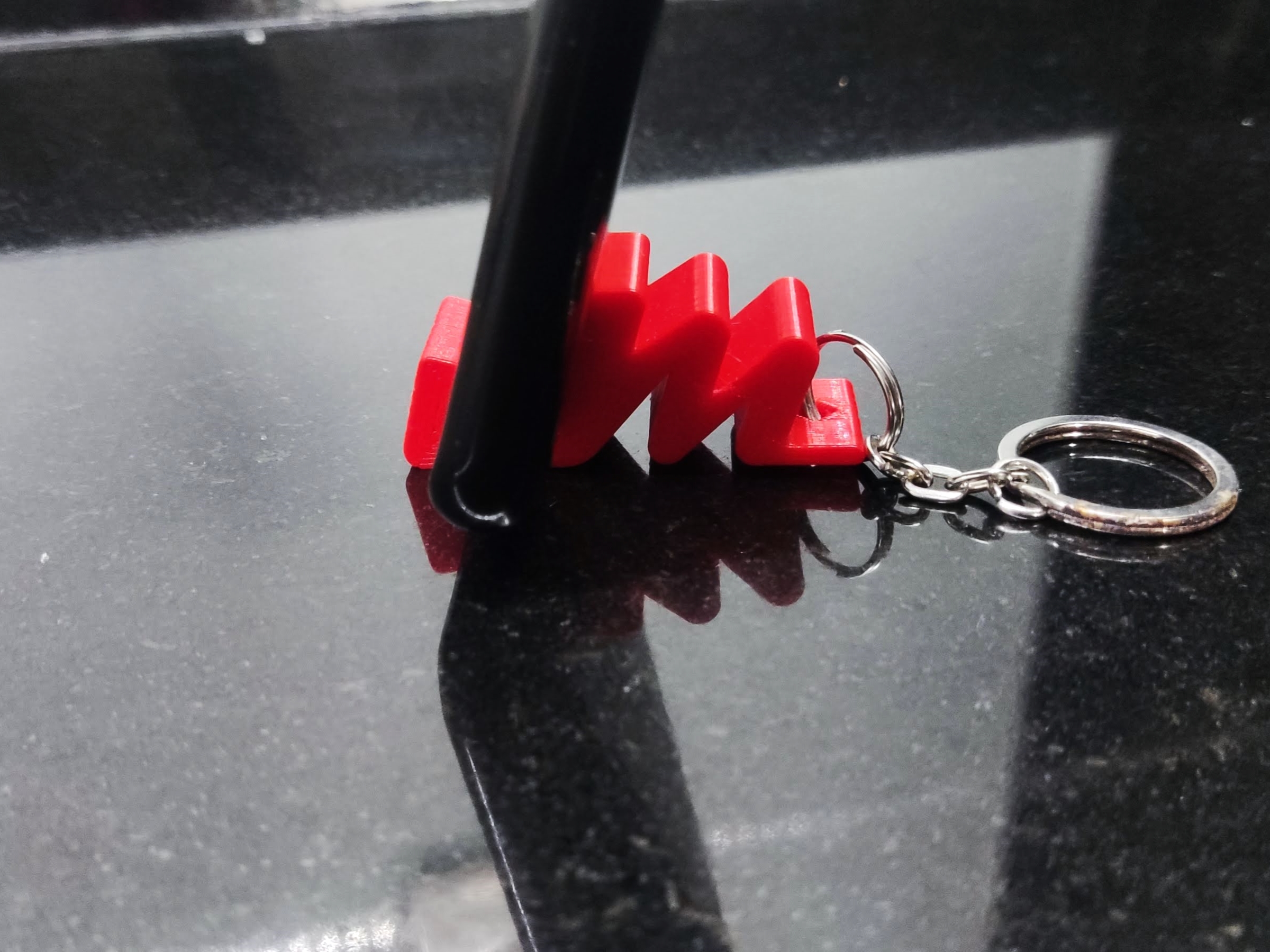 M phone stand keychain