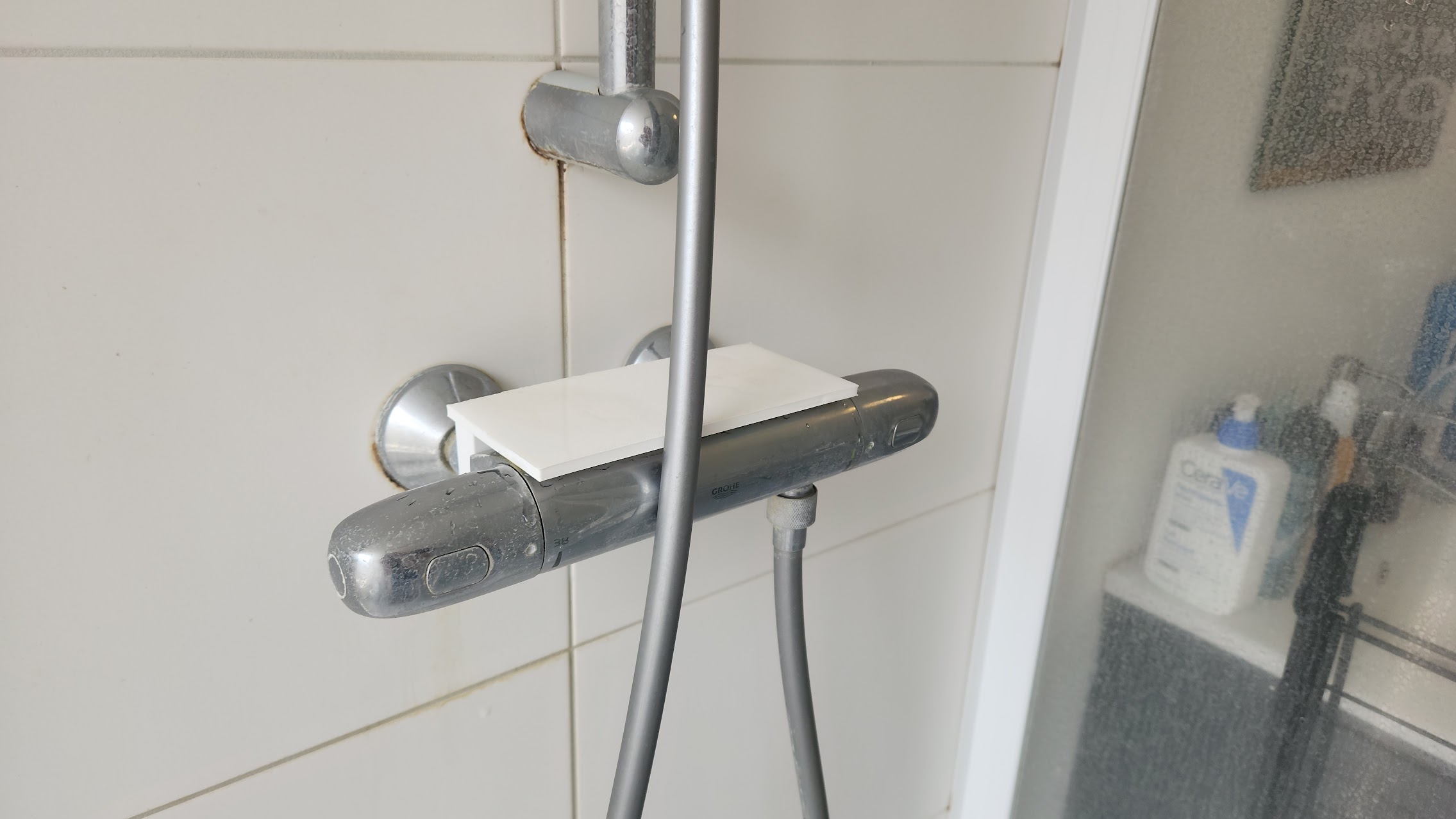 Bathroom tap shelf