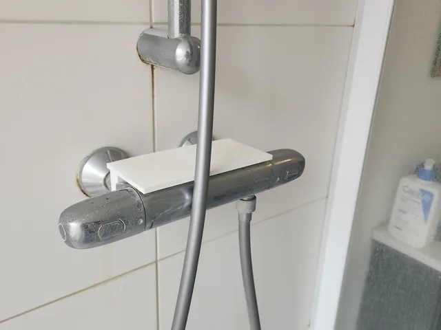 Bathroom tap shelf