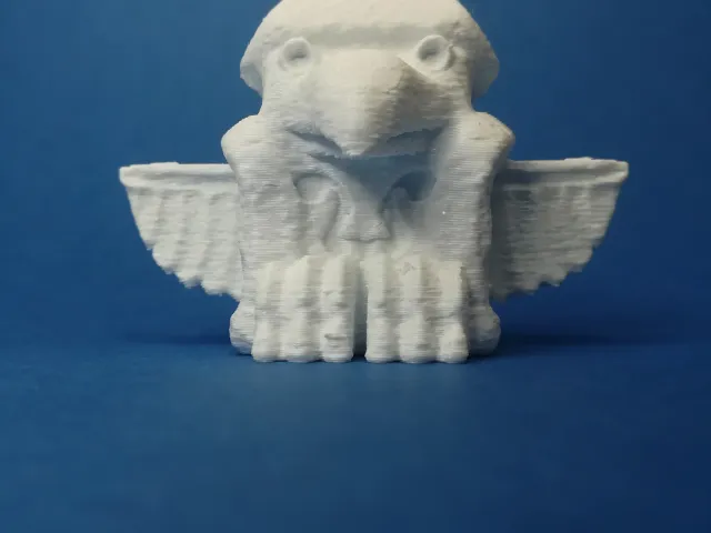 Sculpted totempole bird with wood grain texture